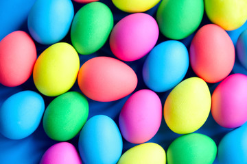 Fototapeta na wymiar Easter eggs background. Many colorful eggs, top view
