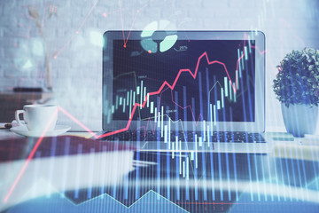 Forex market chart hologram and personal computer background. Double exposure. Concept of investment.