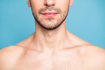 Obraz premium Cropped photo of naked serious man with beard caring about his skin treating it well isolated over blue pastel color background
