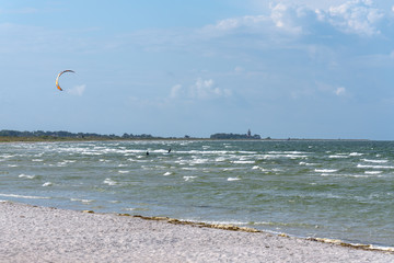 People paragliding at the beach in Skanor