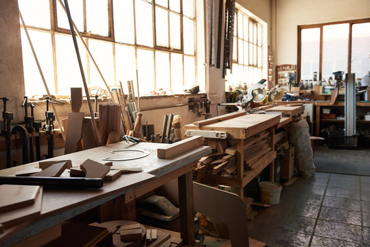 Workbenches inside of a large woodworking shop