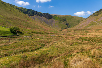 Yorkshire Dales landscape with the Howgill Fells and Cautley Spout in the background, near Low Haygarth, Cumbria, England, UK