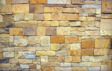 The wall is made of tightly laid square and rectangular stone. Different shades in retro style