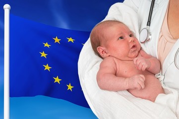 Birth rate in European Union. Newborn baby in hands of doctor.