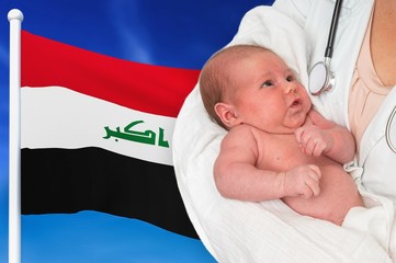 Birth rate in Iraq. Newborn baby in hands of doctor.