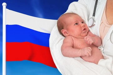 Birth rate in Russia. Newborn baby in hands of doctor.
