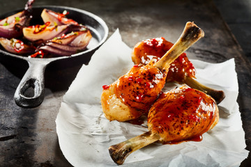 Barbecued spicy chicken legs with chili sauce
