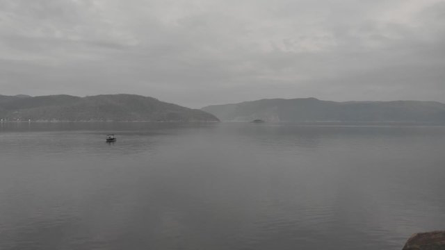 Raw drone footage on Saguenay fjord in a cloudy windless day