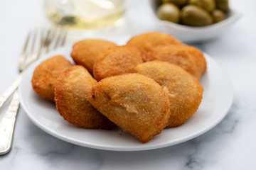 typical portuguese snack with meat rissois de carne on ceramic background