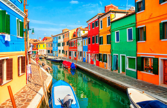 Colorful houses in Burano island near Venice, Veneto, Italy. Canals and streets of Burano. Most colorful traditional fishing town Burano, Italy. Architecture and landmarks of Burano, Venice and Italy