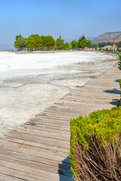 View of the Pamukkale travertine from a wooden floor for the access of tourists.