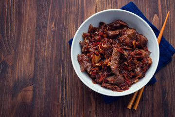 meat with vegetables in white bowl