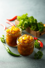 Homemade fruit chutney with pepper and herbs