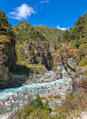 Fototapeta premium Legendary Hillary bridge view in Sagarmatha National Park. Everest base camp trek itinerary: way from Phakding to Namche Bazar, the sherpa's capital.