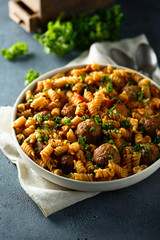 Homemade pasta with meatballs and fresh parsley