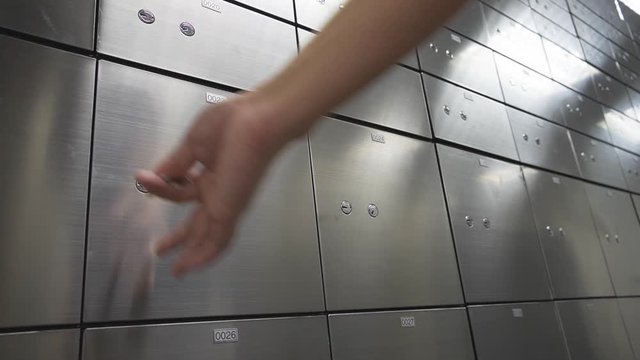 Hand close Metal safe box panel wall. Concept for security and banking protection.