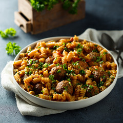 Homemade pasta with meatballs and fresh parsley