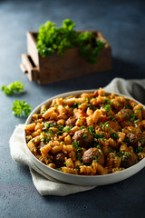 Homemade pasta with meatballs and fresh parsley