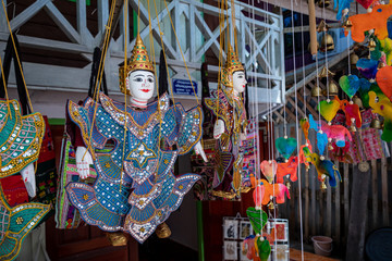 Traditional fabric decorative puppets for sale on the night market in Laos.