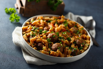 Homemade pasta with meatballs and fresh parsley