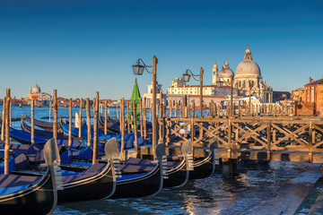 Beautiful view of Grand Canal with Venetian gondolas and Basilica Santa Maria della Salute at...