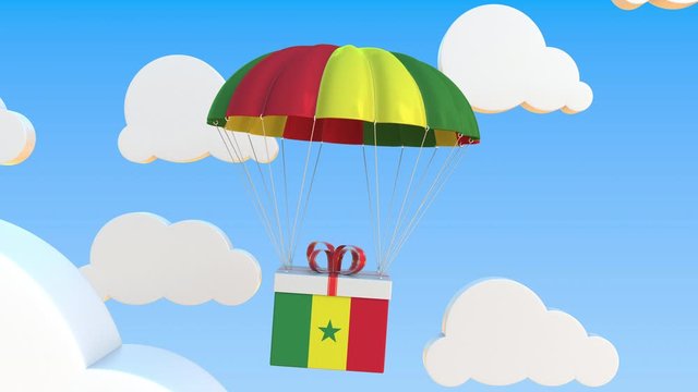 Box with national flag of Senegal falls with a parachute. Loopable conceptual 3D animation
