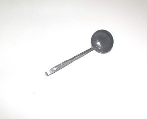 an old stainless steel vegetables spoon isolated on white background