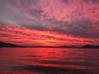 Red orange fire sunset at the sea