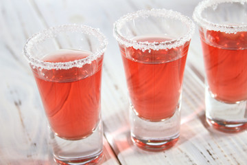 Three glasses with alcoholic drinks