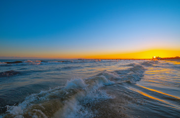 Fototapeta premium On the Baltic Sea in the winter month of January. Sunrise near the 'Seebrücke' (pier) at the German town of Ahlbeck.