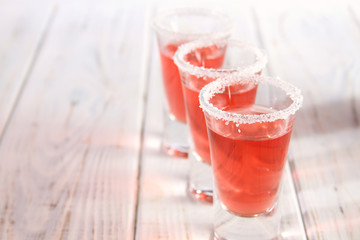 Three glasses with alcoholic drinks