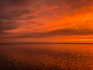 Red orange fire sunset at the sea