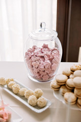 Tasty pasta with meringue cakes and other sweets. Wedding Candy Bar.