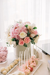 Wedding Candy Bar with flowers and sweets. Cake pop pops.