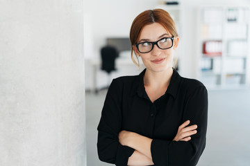 Young business manageress looking up