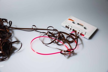 Leeds, UK, 03/02/19Cassette unspooled with loose tape tangled up around itself shot on isolated on...