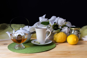 Morning tea, a bouquet of irises on the table close-up