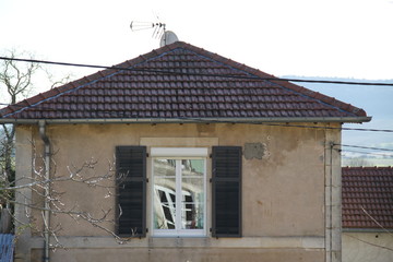 Tiny village house reflect on the window