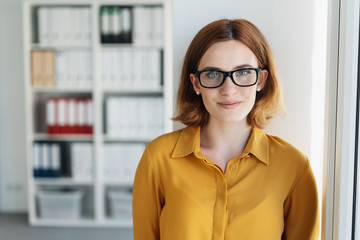 Smiling young businesswoman wearing glasses