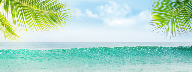 Fototapeta na wymiar Summer tropical sea with waves and blue sky
