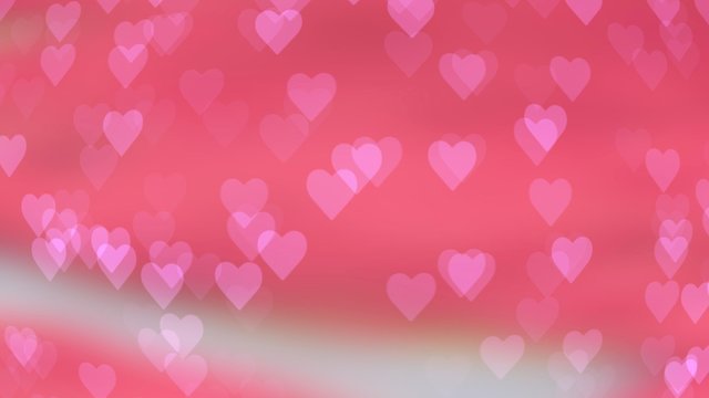 Abstract bokeh in the shape of a heart on a colored background