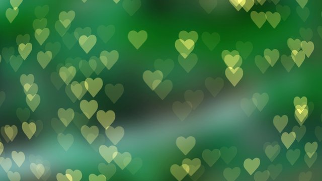 Abstract bokeh in the shape of a heart on a colored background