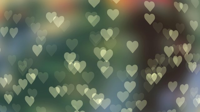 Abstract bokeh in the shape of a heart on a colored background