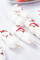 Marshmallow snowmen on sticks