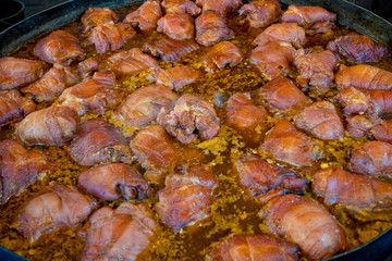 Pork knuckle in sauce. Close-up.