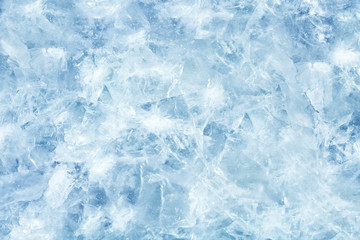 Fototapeta na wymiar Cracked light blue ice. Frozen water in winter