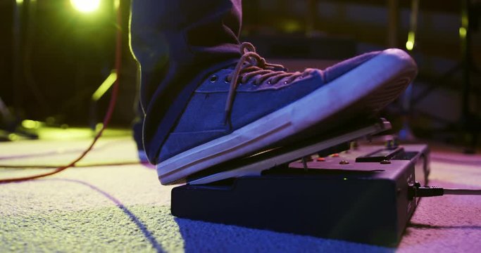 Musician using a pedal point in a music studio