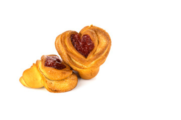 filled buns in the shape of a heart, on a white background