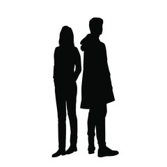 Vector silhouettes of  man and a woman, a couple of standing business people, black color isolated on white background