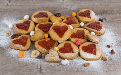 filled buns with a heart shape, on a wooden background